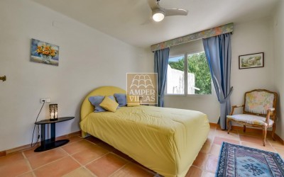 A beautiful villa in a peaceful, green setting.